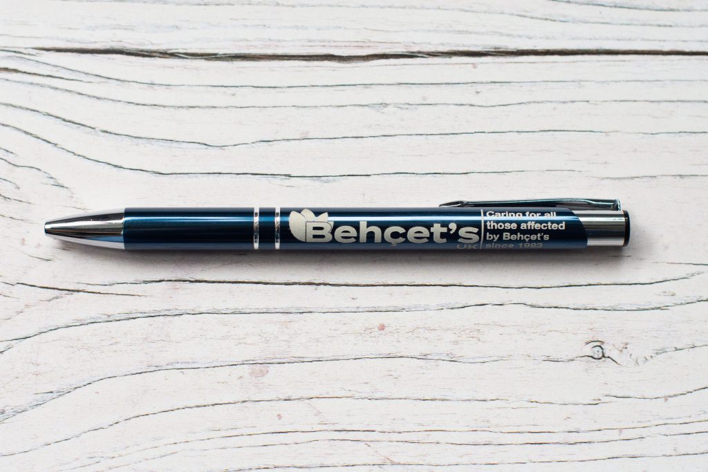 Close-up photo of a Behçet's UK laser engraved metal pen