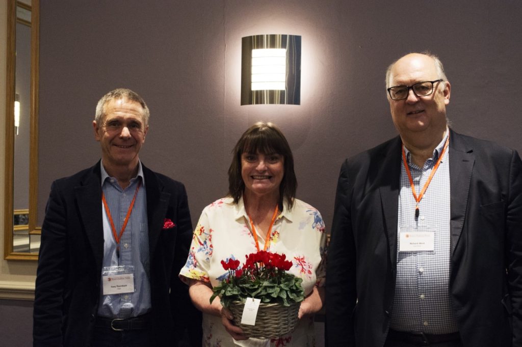 Photo of Tony Thornburn, chair, and Richard West, vice-chair with Julie Collier, winner of the 2018 award