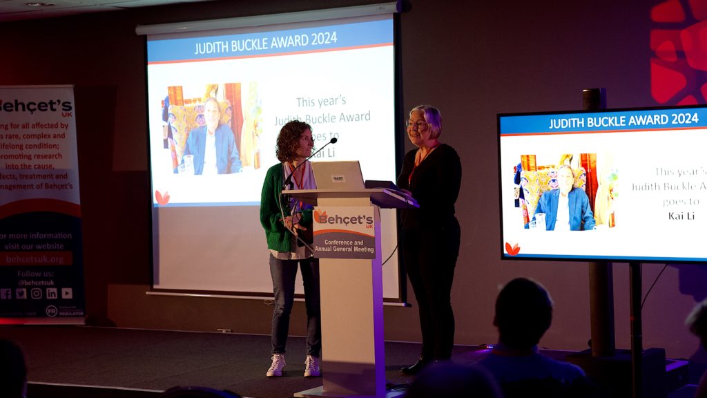 Image of Jan Mather accepting the award from Trustee Rachael Humphreys on behalf of Kai