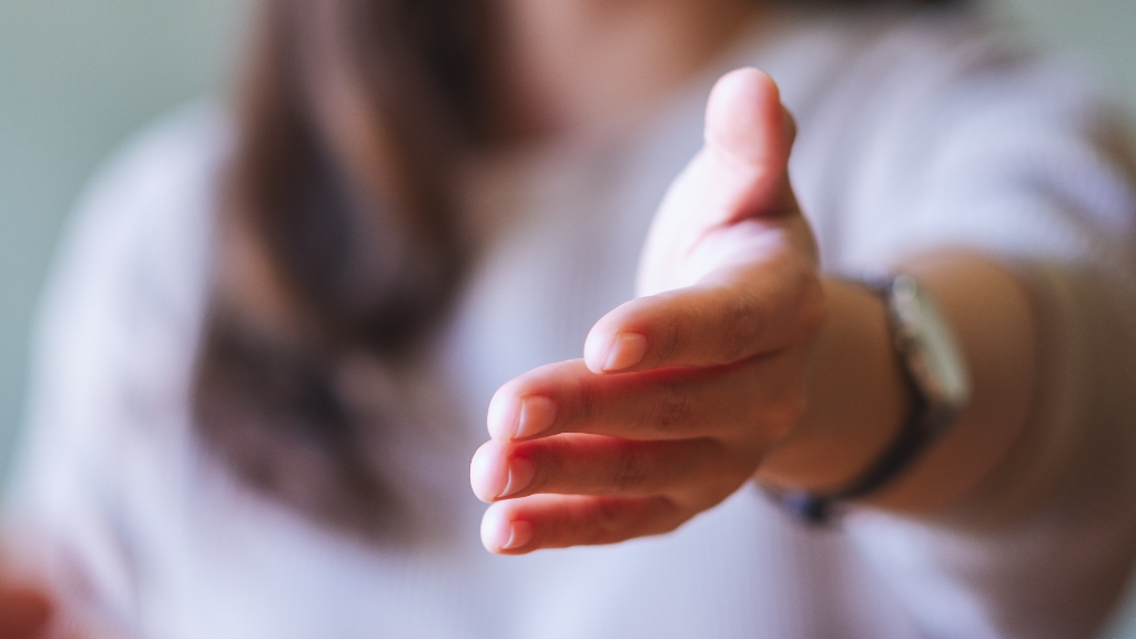 An outstretched hand offering a lifeline and support, symbolising the our support services.